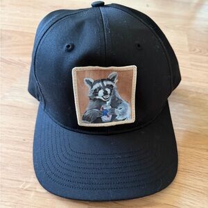 Trucker hat with Raccoon holding Pabst Blue ribbon beer
